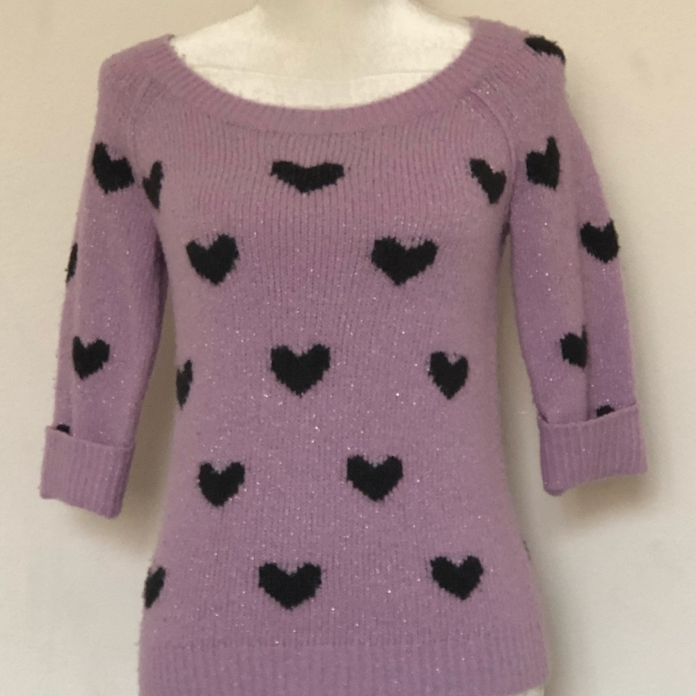 Purple sweater with black hearts